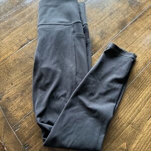 2 pair of Athleta 7/8 Salutation Stash Pocket tights.